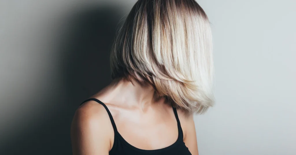 Woman with short blonde hair volume styling
