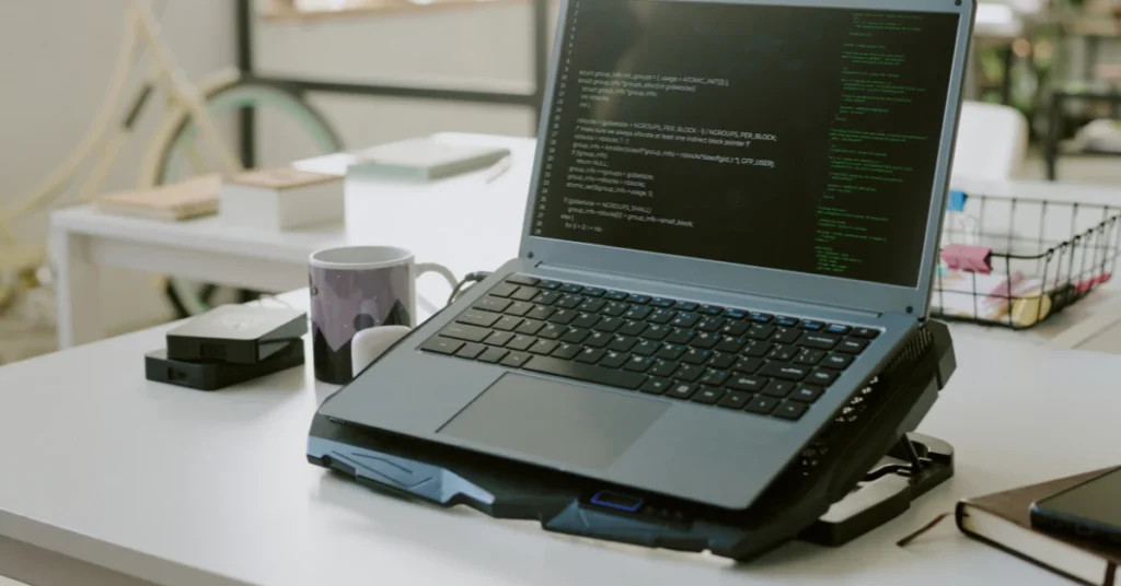 Laptop on a cooling pad placed on a desk