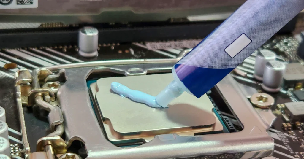 Applying thermal paste on a laptop processor