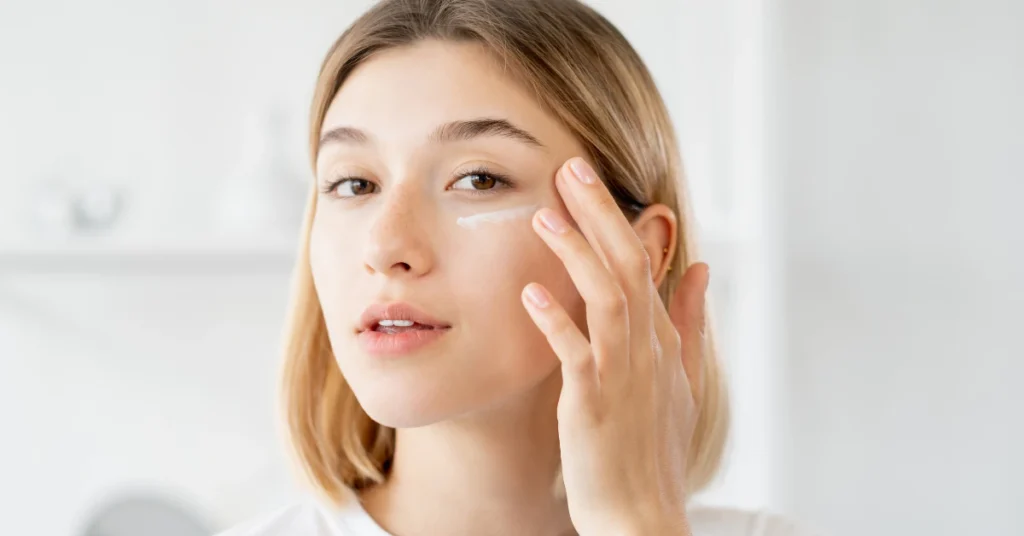 Woman gently touching the skin under her eye