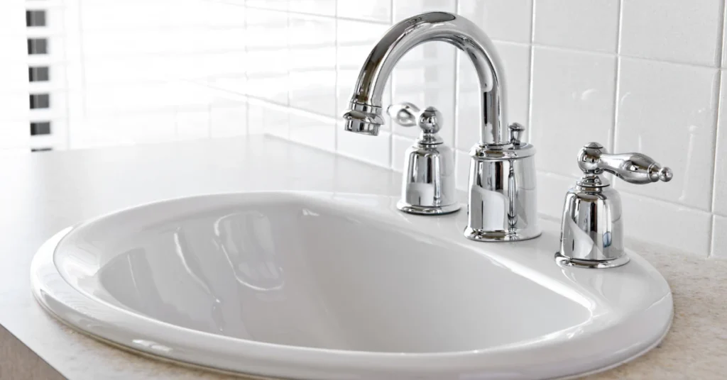 White bathroom sink with a chrome faucet