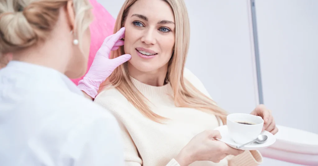 Dermatologist consulting with a smiling female patient during a skin treatment visit