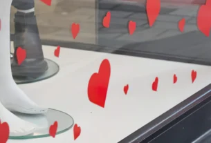 Red heart stickers on a glass window