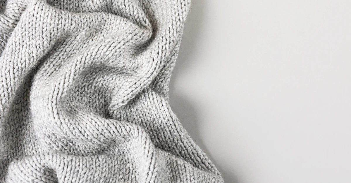 Soft gray wool blanket loosely folded and draped